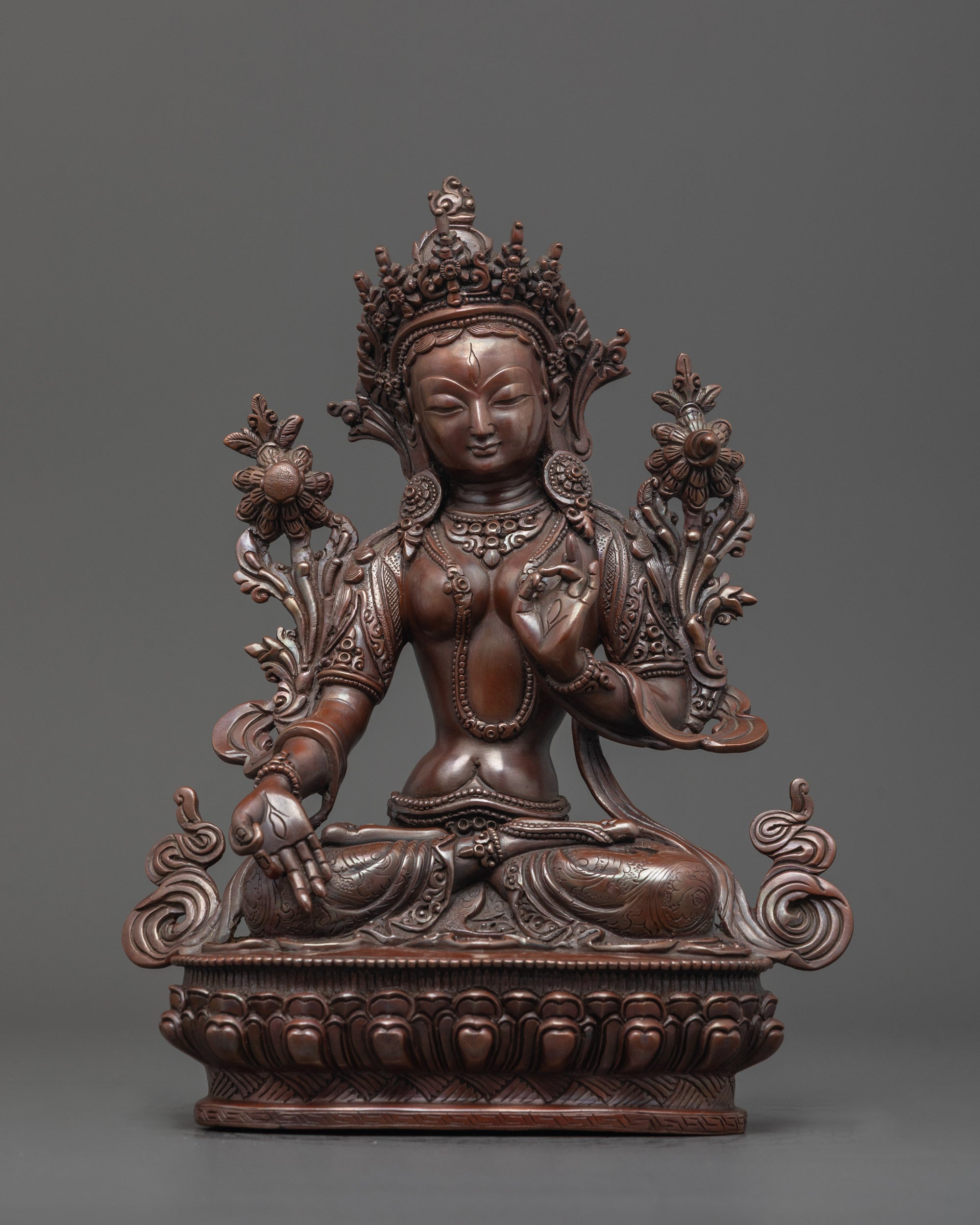 Front-facing view of Oxidized White Tara Statue seated on lotus base with seven eyes