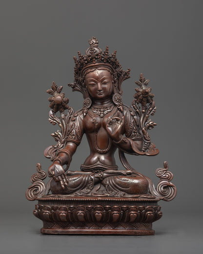 Front-facing view of Oxidized White Tara Statue seated on lotus base with seven eyes