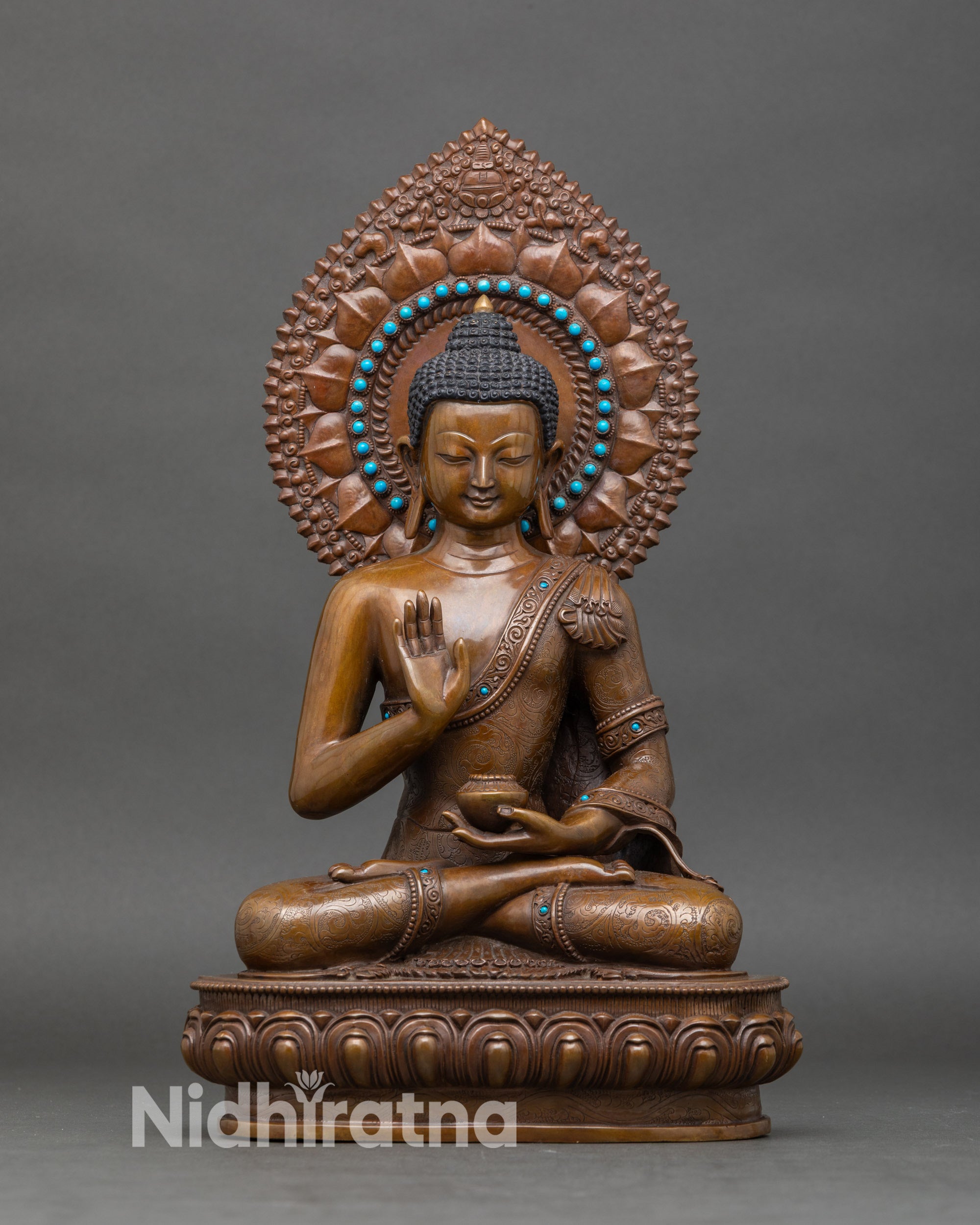 Front-view-Amoghasiddhi-Buddha-statue-handcrafted-Newar-artisan-Nepalese-copper-oxidized-shrine-decor