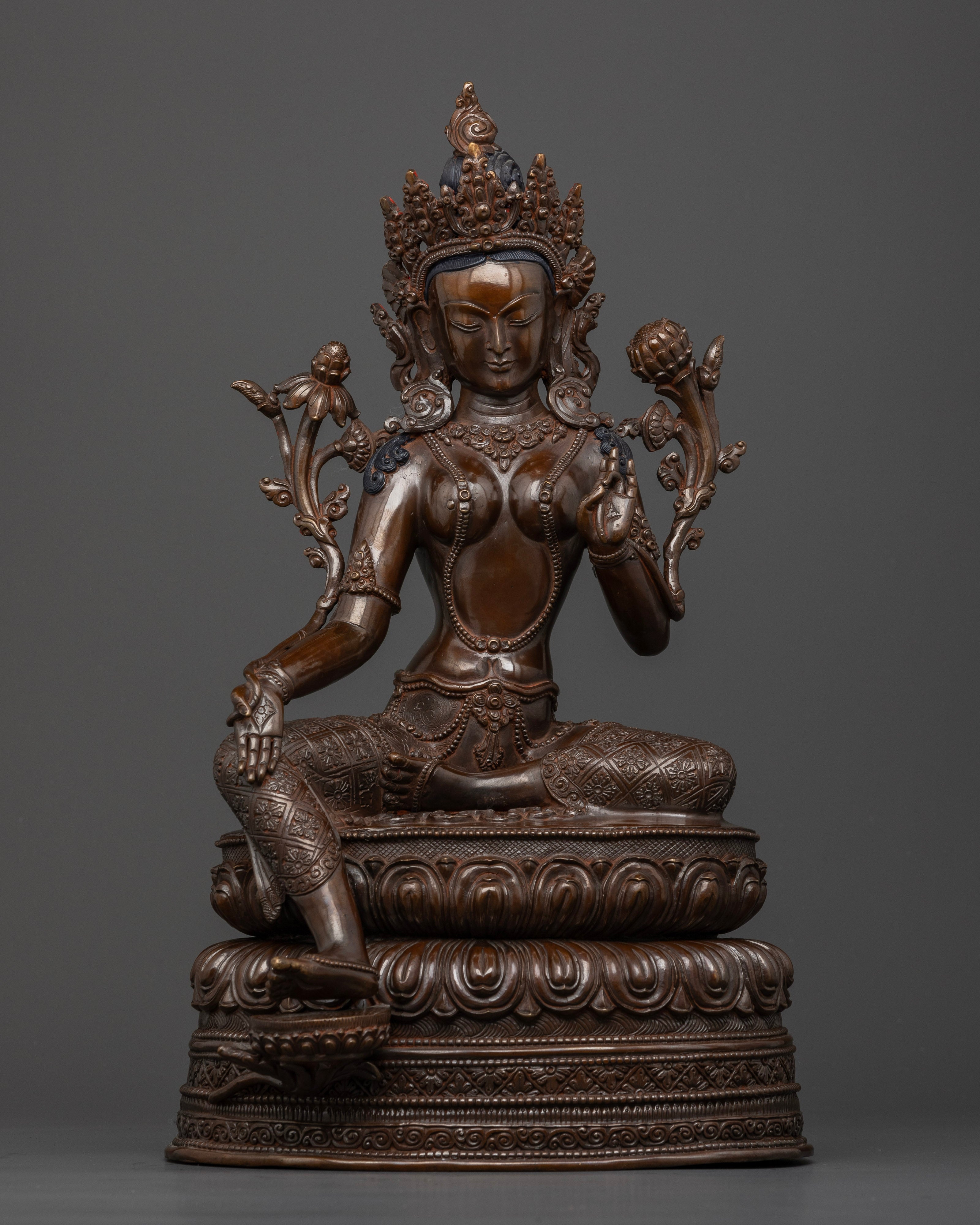 Front view of Dark oxidized Green Tara statue copper seated on double lotus hand-crafted in Nepal
