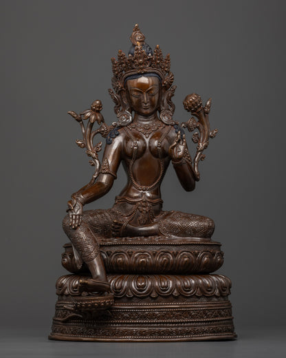 Front view of Dark oxidized Green Tara statue copper seated on double lotus hand-crafted in Nepal