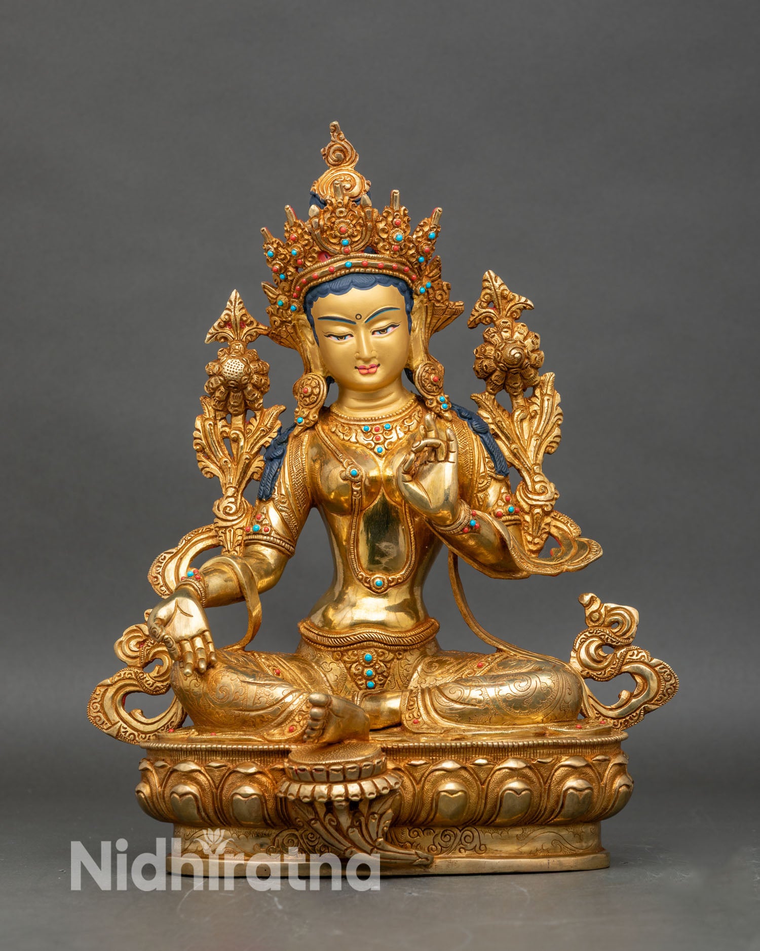 Front view of Green Tara gold fire-gilded copper statue, seated on lotus pedestal Himalayan art