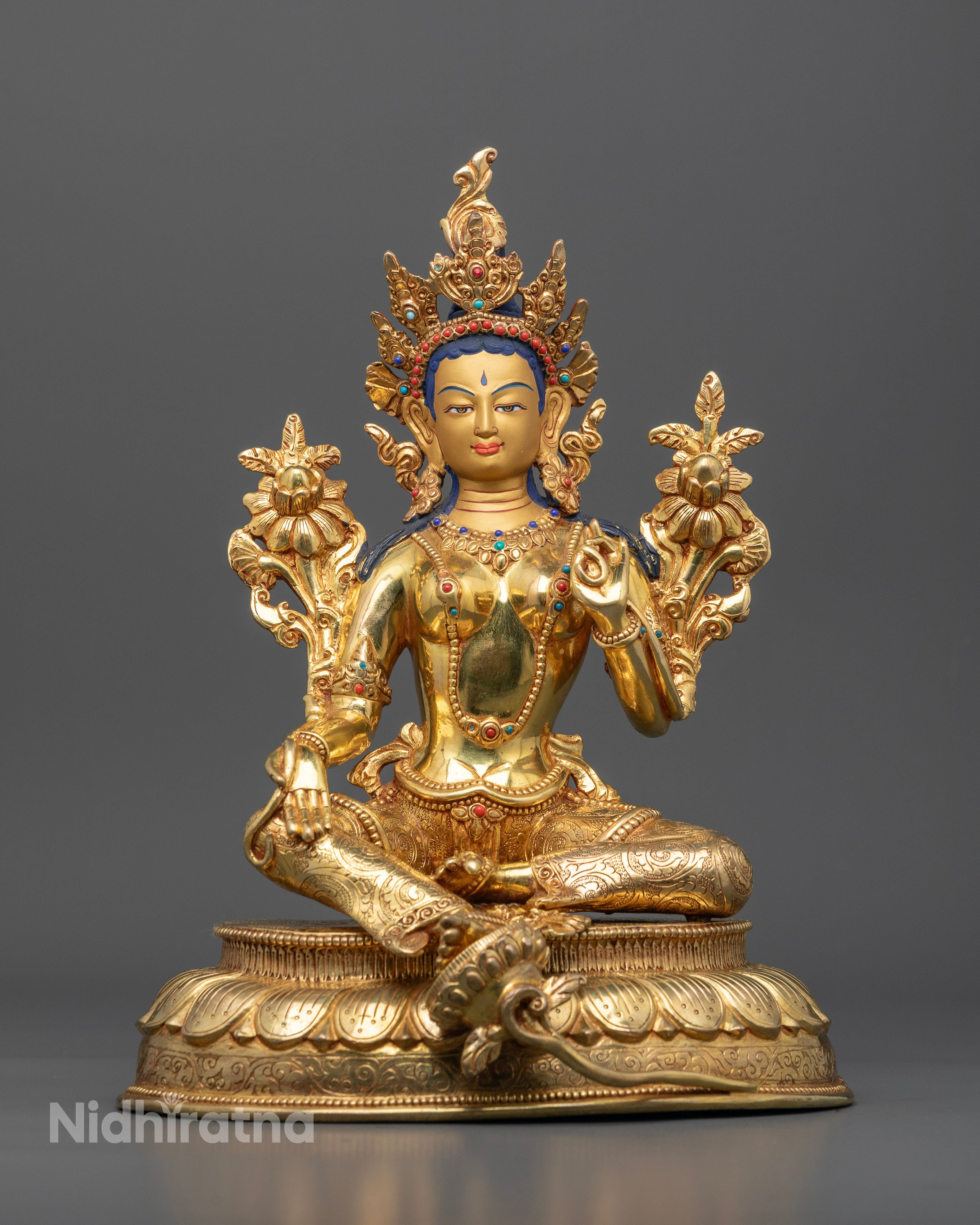 Front view of Green Tara statue gold-painted face 24k gold gilded copper lotus pedestal Nepal