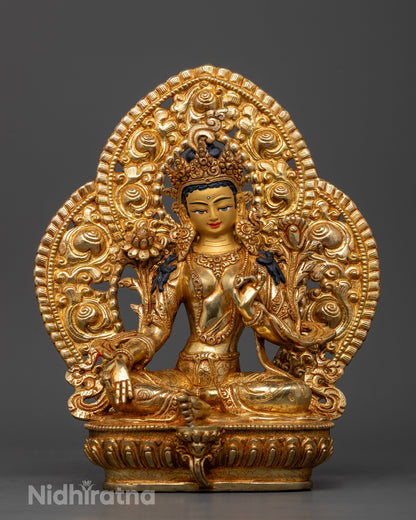 Front view of Green Tara statue gold-painted face lotus pedestal handcrafted Nepalese deity
