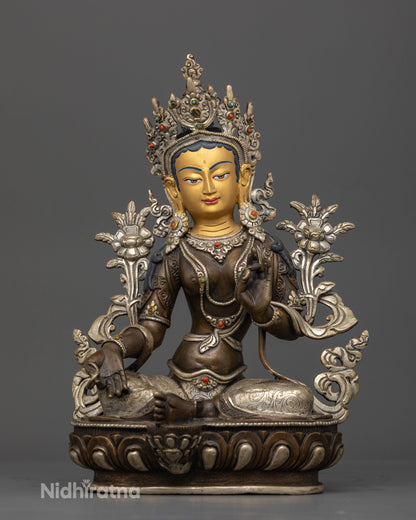 Front view of Green Tara statue gold-painted face oxidized silver-plated copper double lotus Nepal