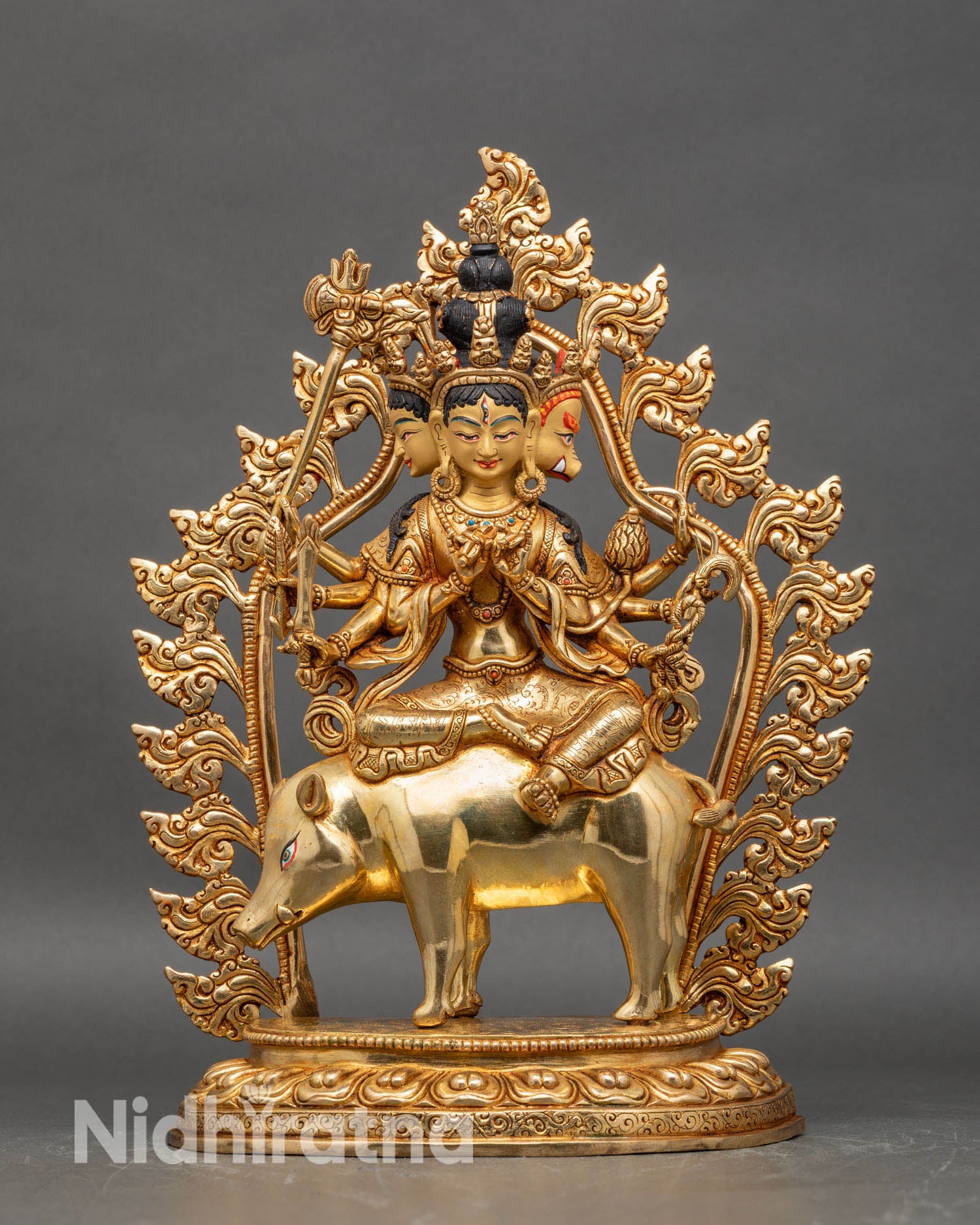 Front view of Marichi gold gilded copper statue, riding sow three faces multi arms Himalayan art