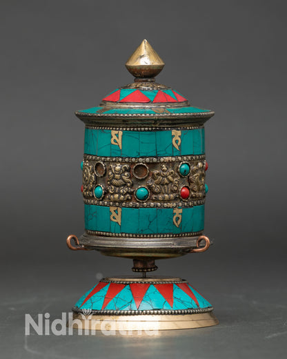 Front view of Tibetan Prayer Wheel handcrafted copper engraved mantras eight auspicious symbols