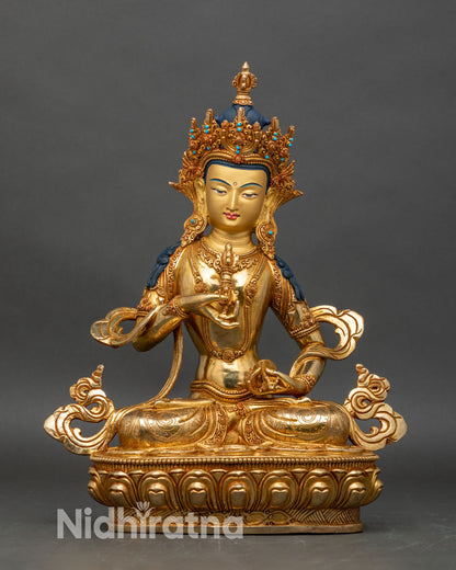 Front view of Vajrasattva gold gilded copper statue, holding vajra and bell Himalayan art