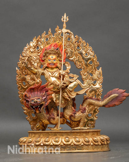 Front view White Dzambhala statue, seated on dragon gold fire-gilded copper Himalayan art