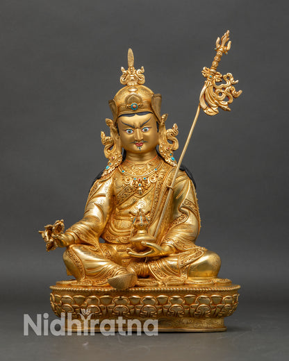 Front view of Guru Rinpoche Padmasambhava Statue handcrafted copper fire-gilded gold turquoise Nepal