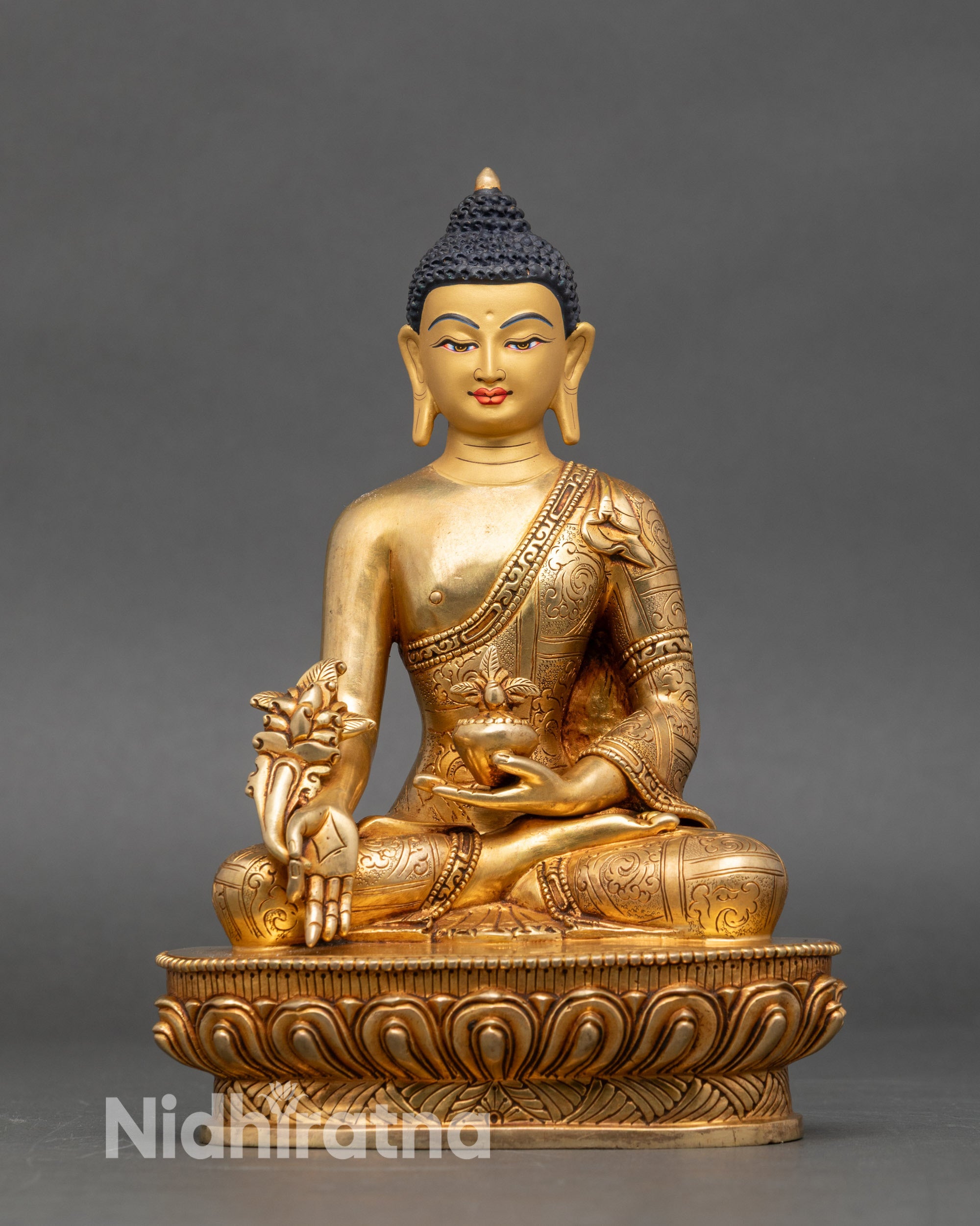 Front view of Medicine Buddha statue for home altar, handcrafted copper and gold sculpture