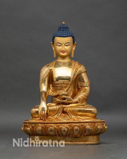 Front view of Shakyamuni Buddha statue, copper with gold fire-gilded details