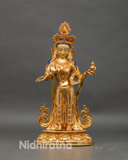 Front view of Yeshe Tsogyal statue, 24K gold-gilded copper, standing on lotus pedestal