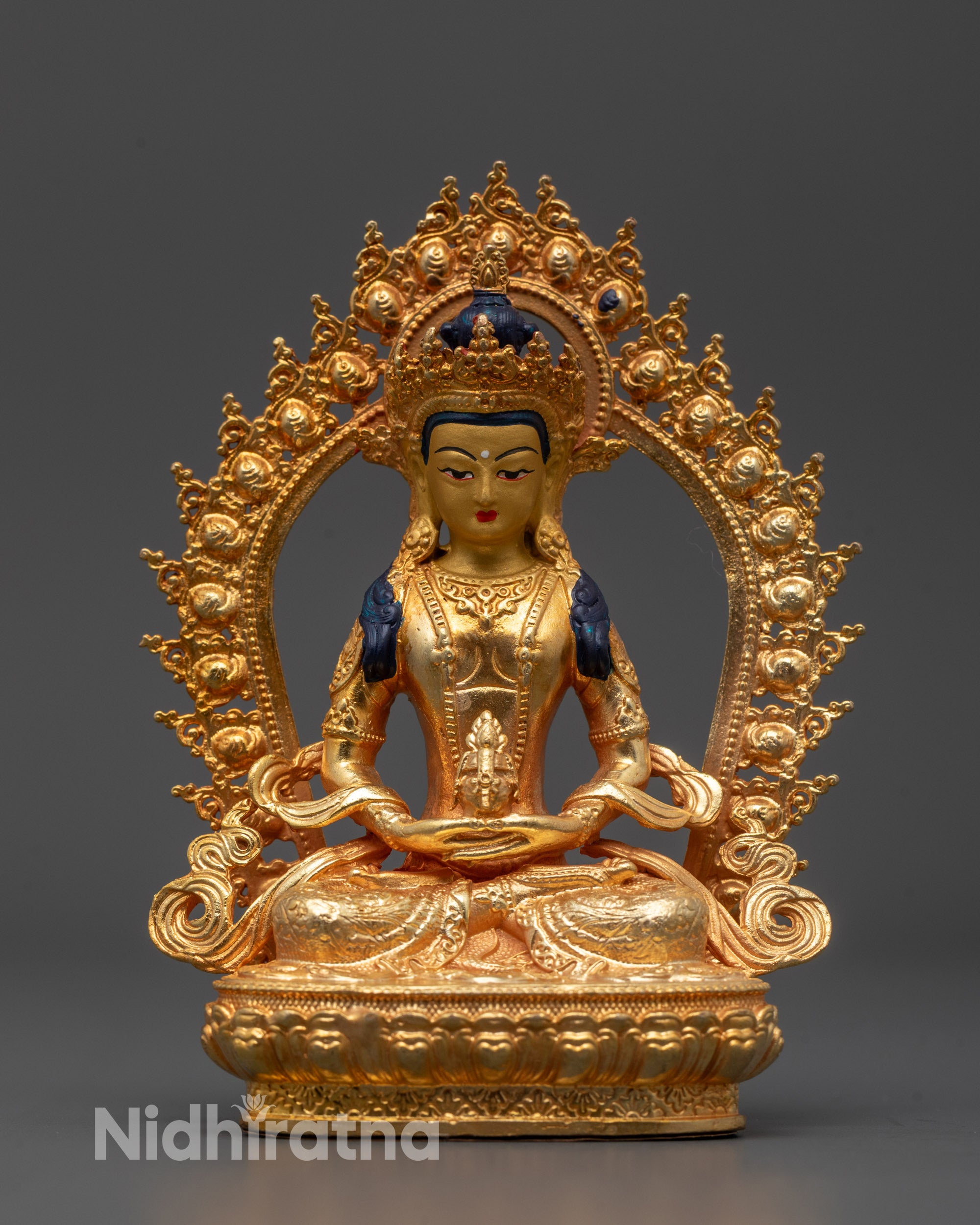 Front-view of Amitayus Buddha statue seated on a lotus base with a kalash in hand