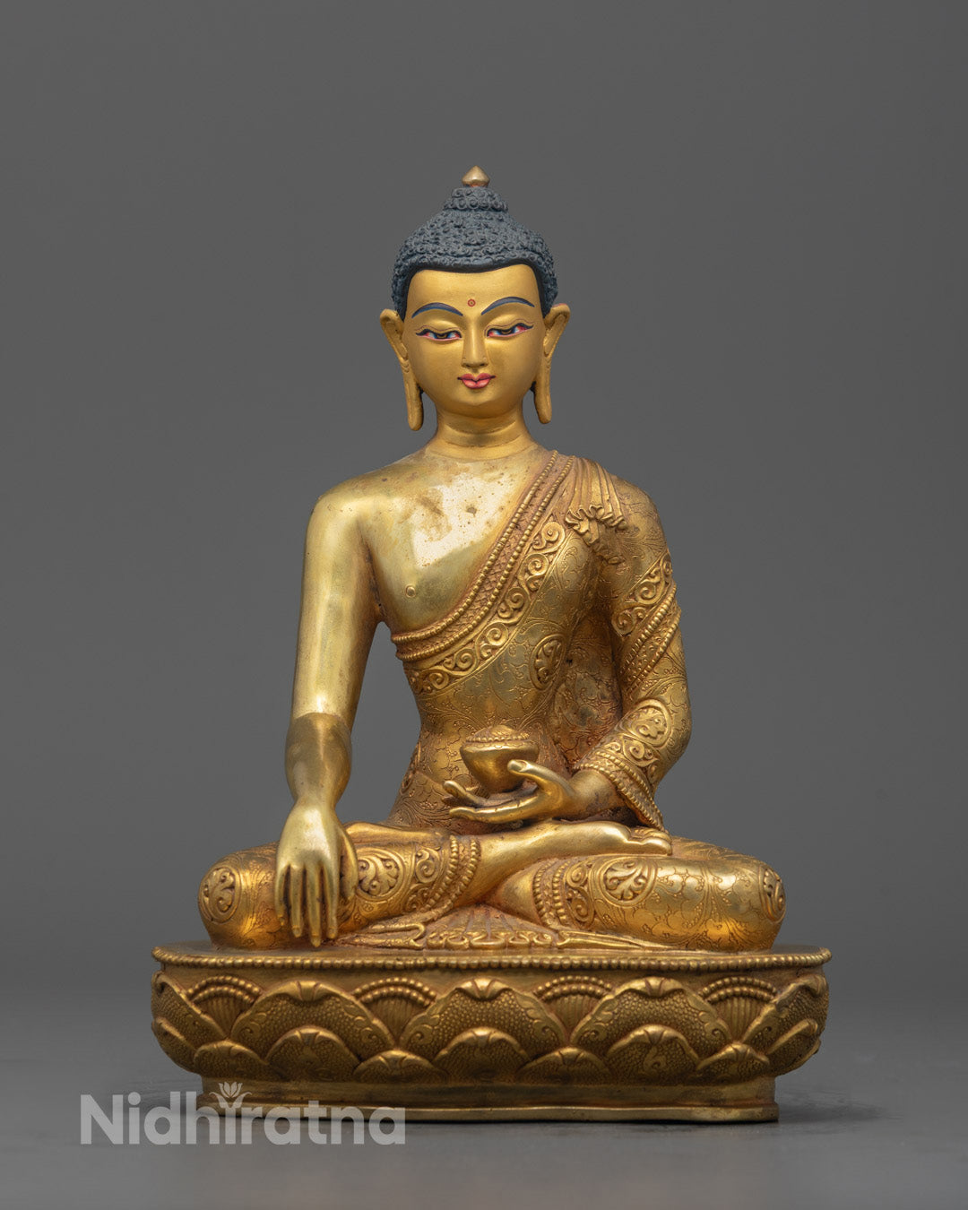 Front-view of Hand-carved Buddha Shakyamuni Sculpture seated in meditation on lotus throne