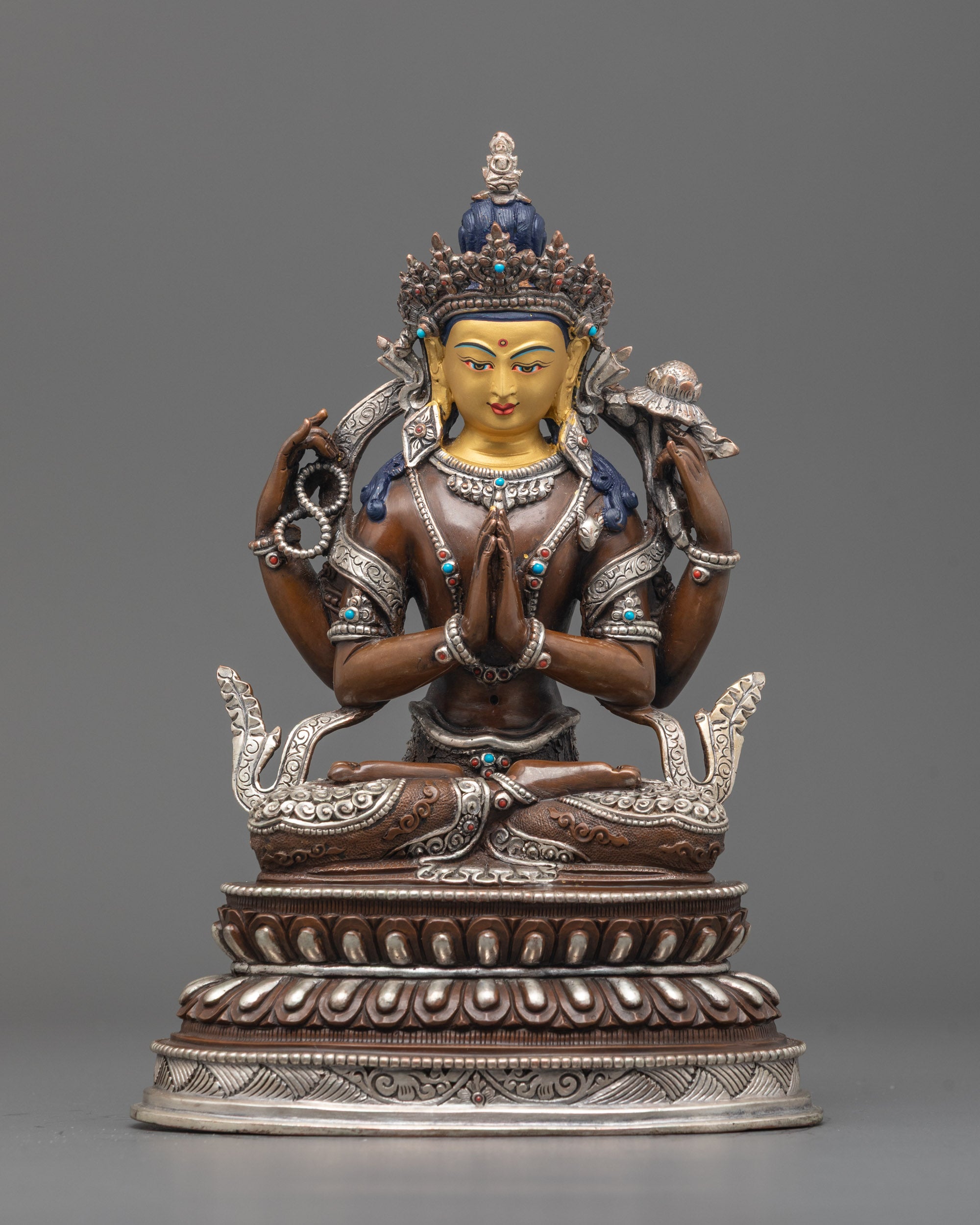 Front-view of Hand-carved Chenrezig statue made of oxidized copper with silver finish
