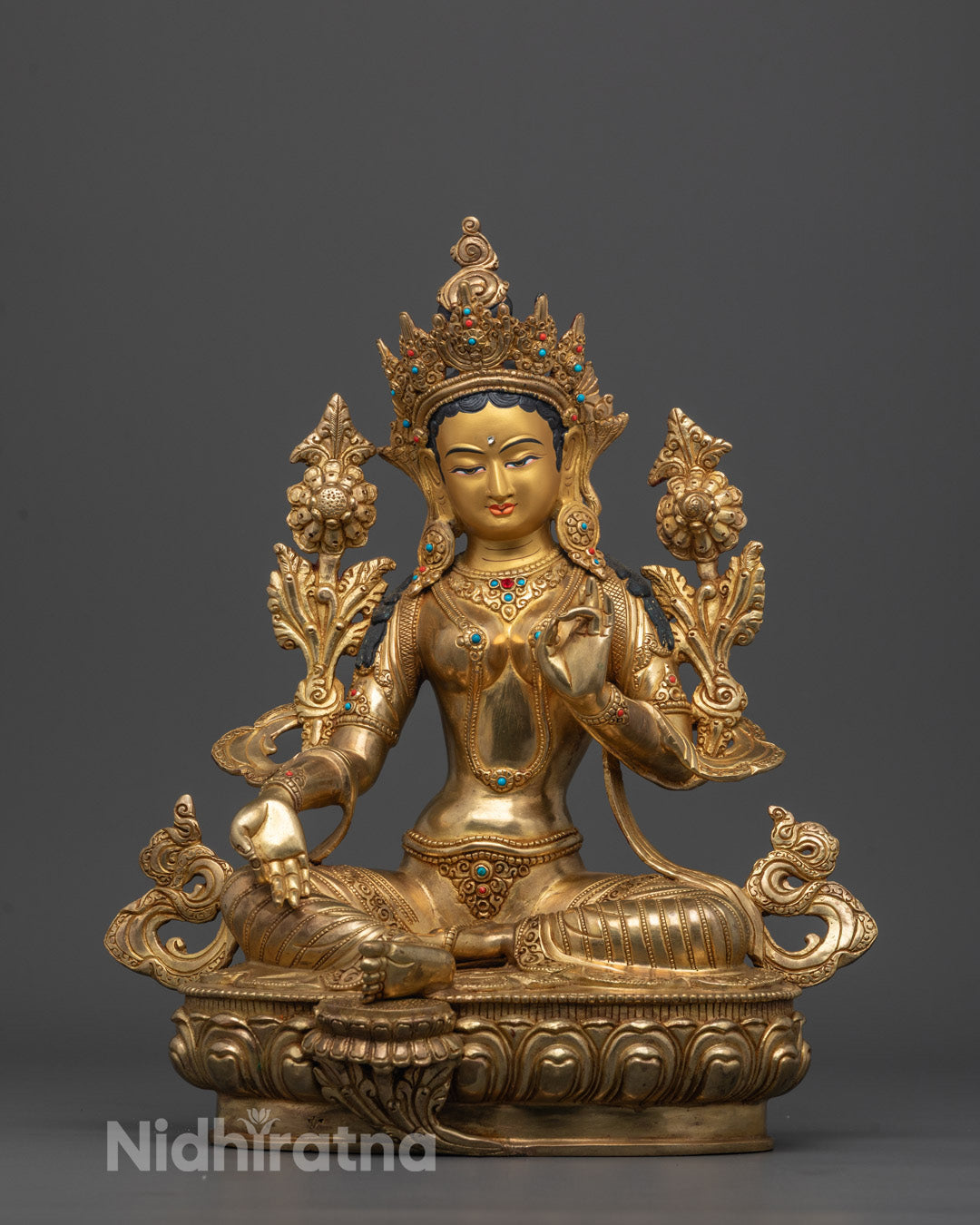 Front-view of Hand-carved Green Tara Statue seated in varada mudra on lotus base