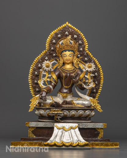 Front-view of Hand-carved Green Tara statue with 24k gold gilded face and silver-plated details