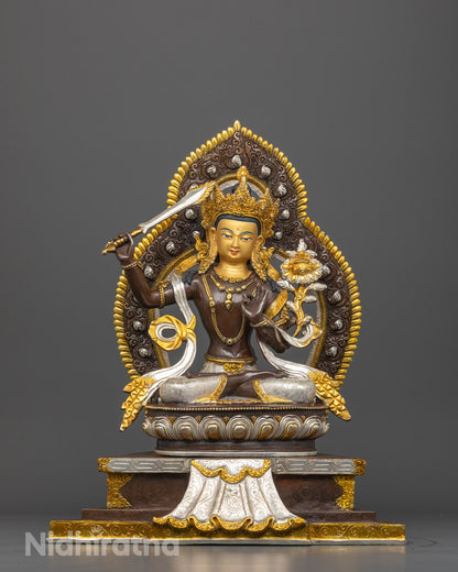 Front-view of Hand-carved Manjushri Buddha statue with flaming sword and lotus flower
