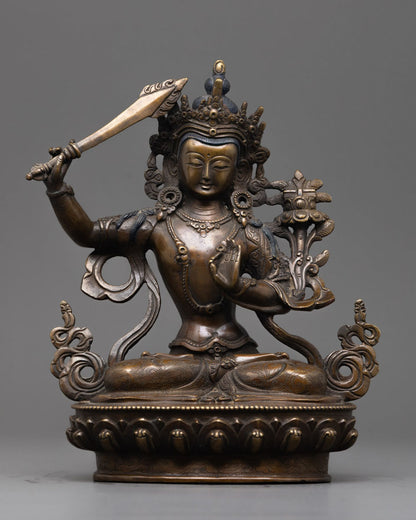 Front-view of Hand-carved Manjushri Statue seated on lotus base holding sword