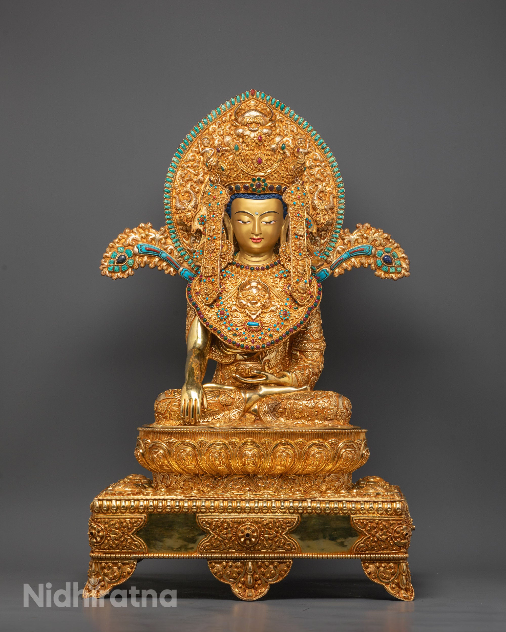 Front-view of Jowo Rinpoche Buddha statue with gold crown seated on lotus throne