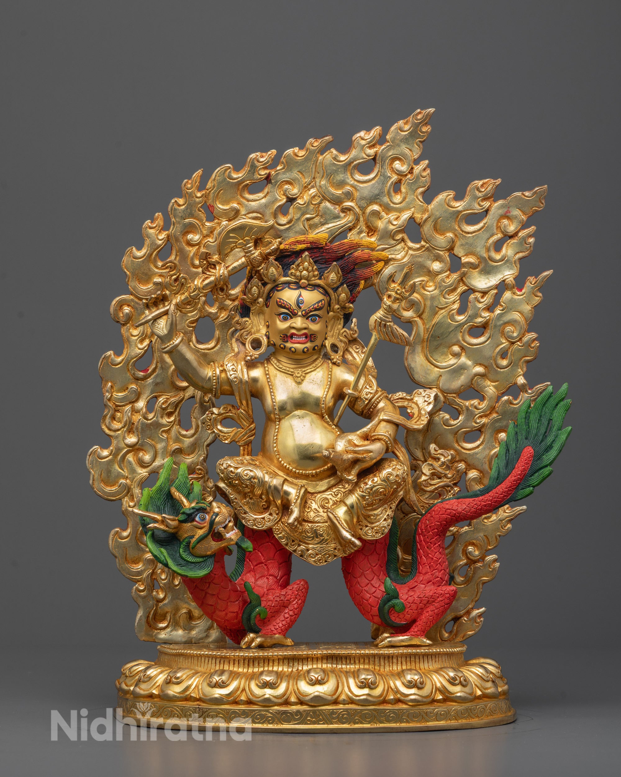 Front-view of White Dzambhala statue hand-carved from copper and gilded with 24k gold
