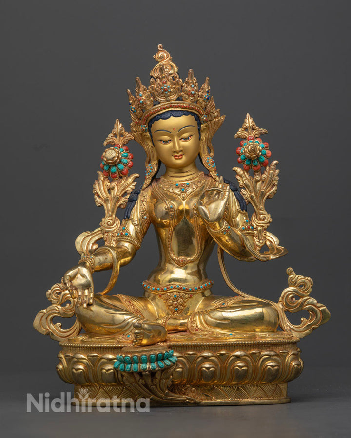 Full picture of Green Tara in Copper and 24K Gold Gilded, adorned with Turquoise and coral stones with her symbolism and significance.