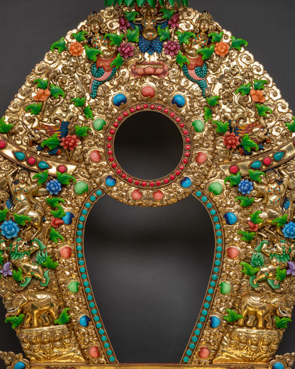 Front close up of Tibetan throne showing gold-gilded torana and floral carvings

