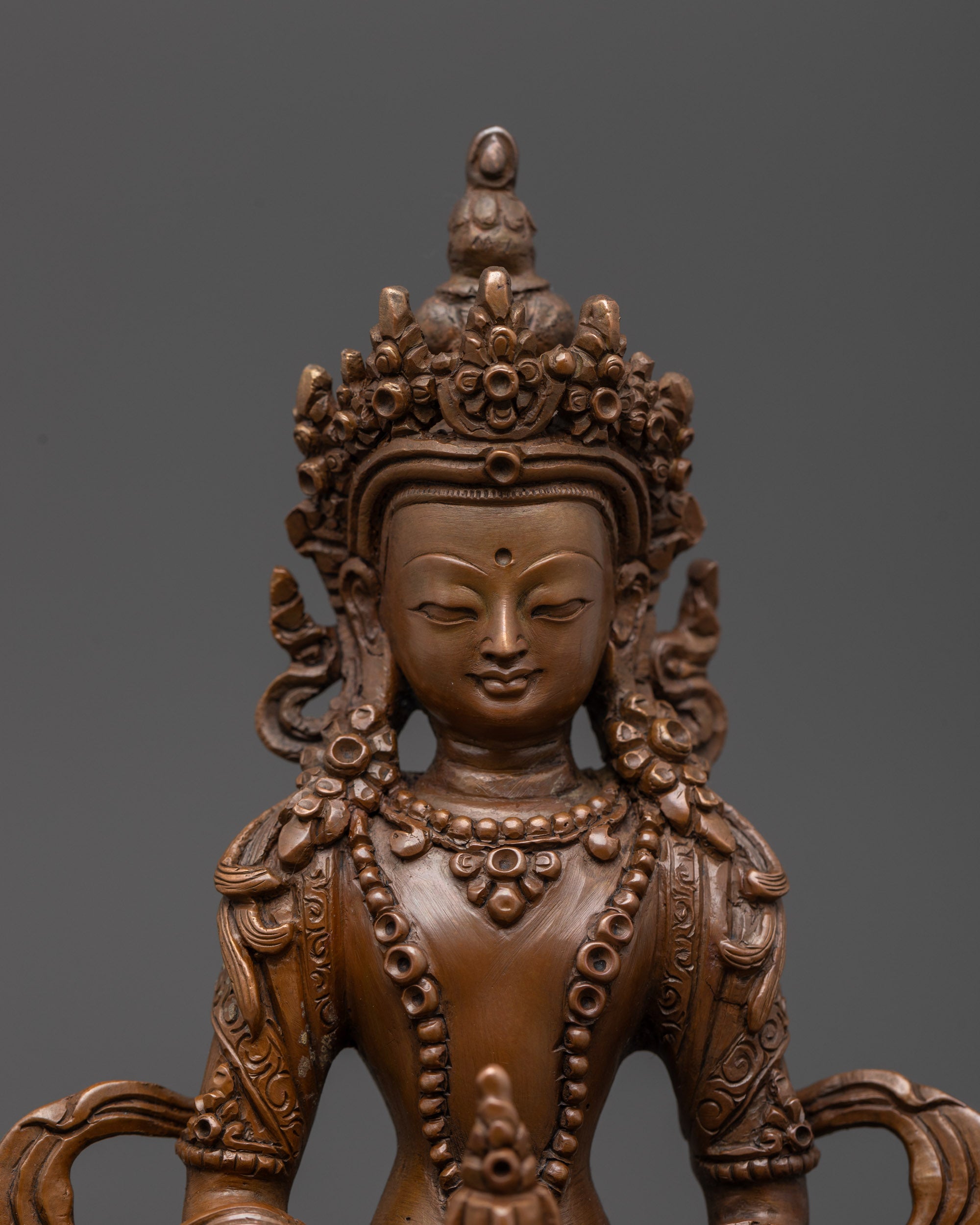 Front view Amitayus with flowing robes, crown, and detailed jewelry armlets