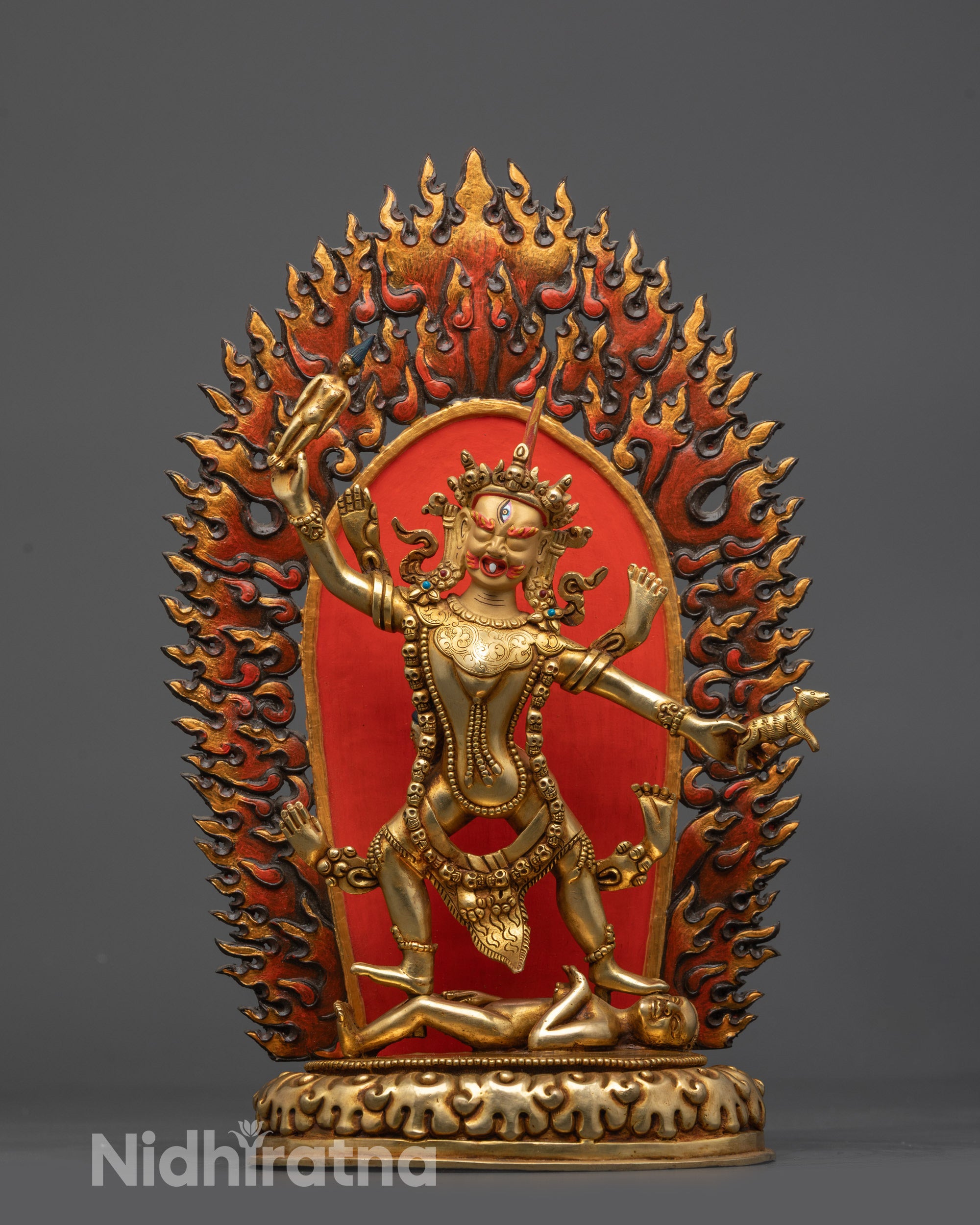Front view Blue Tara Ekajati statue with gold-gilded face and fire-gilded body on copper base
