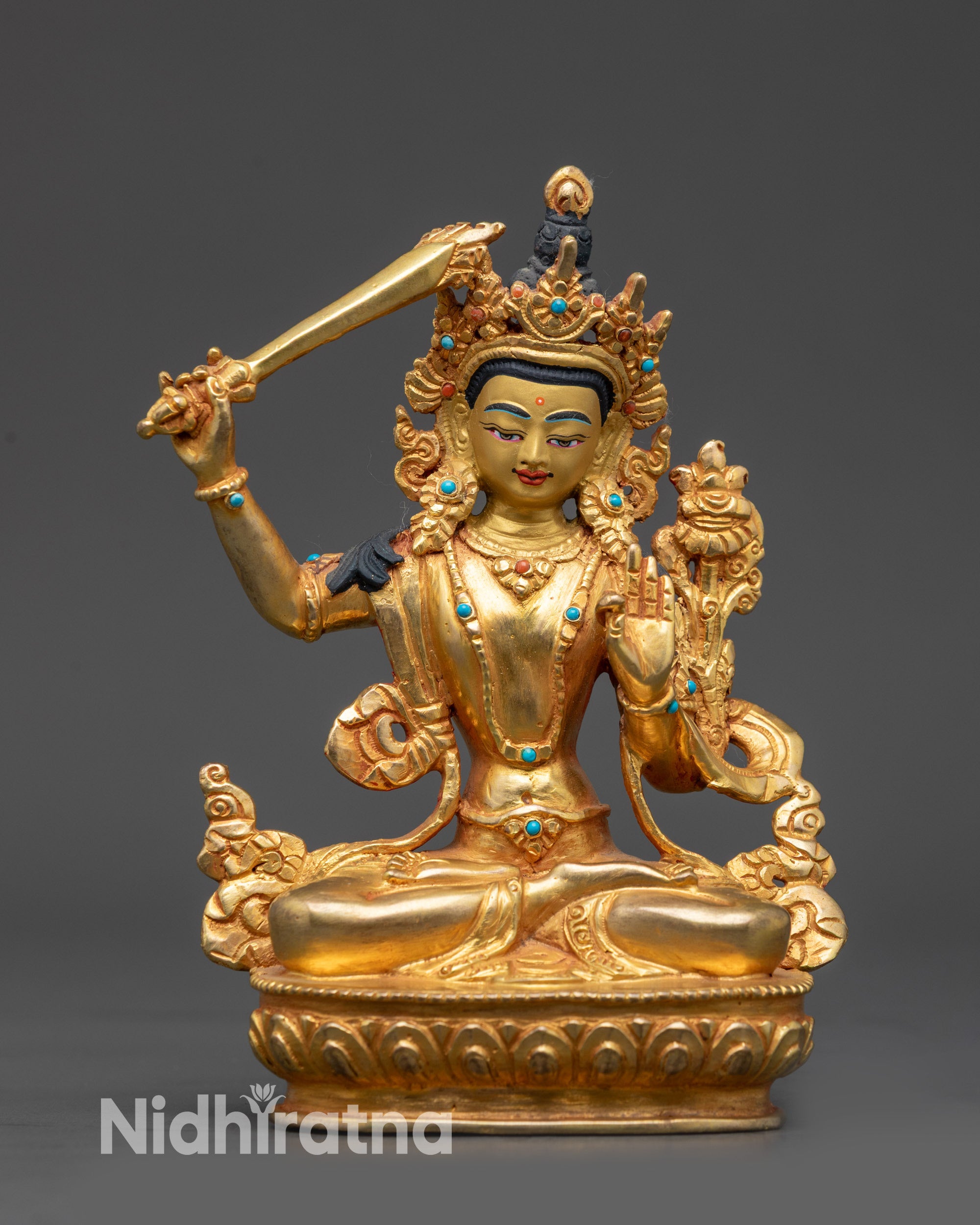 Front view Bodhisattva Manjushri Statue with gold-gilded face and sword of wisdom

