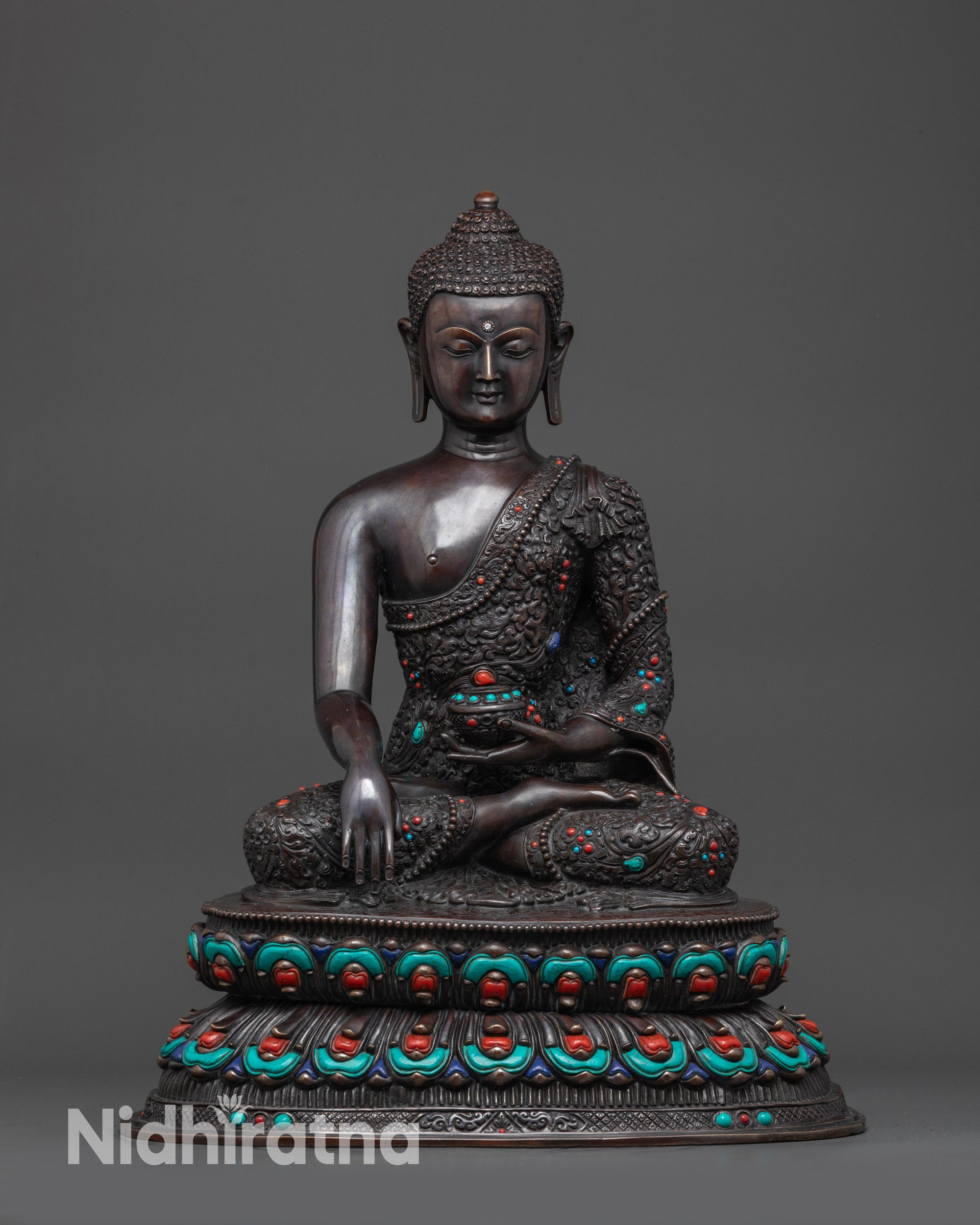 Front view Buddha Shakyamuni oxidized statue with detailed carvings and semi-precious stones
