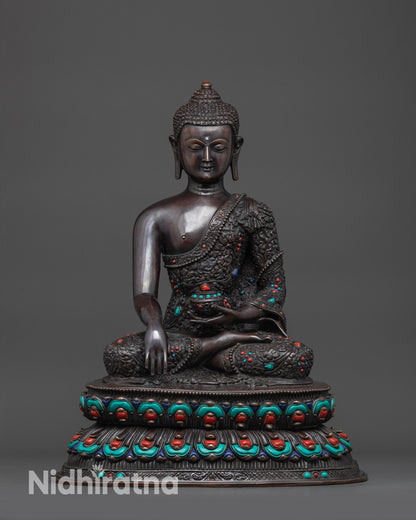 Front view Buddha Shakyamuni oxidized statue with detailed carvings and semi-precious stones
