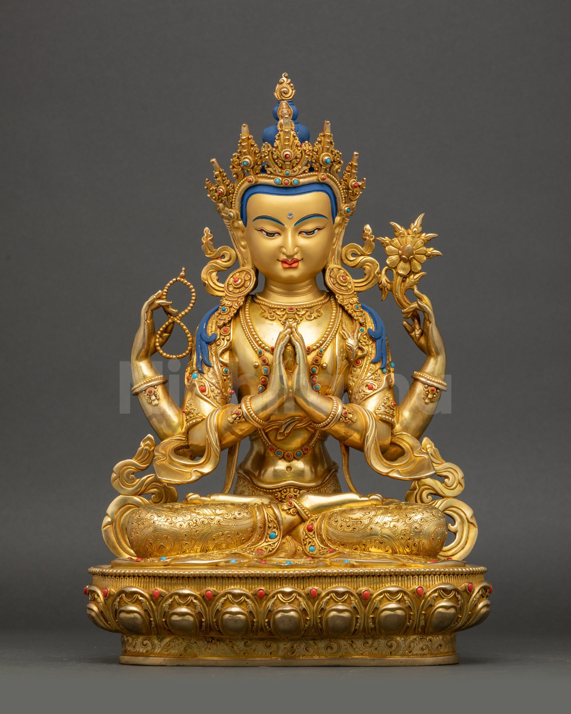Front view Chenrezig statue gold-gilded copper seated on double lotus throne Nepal