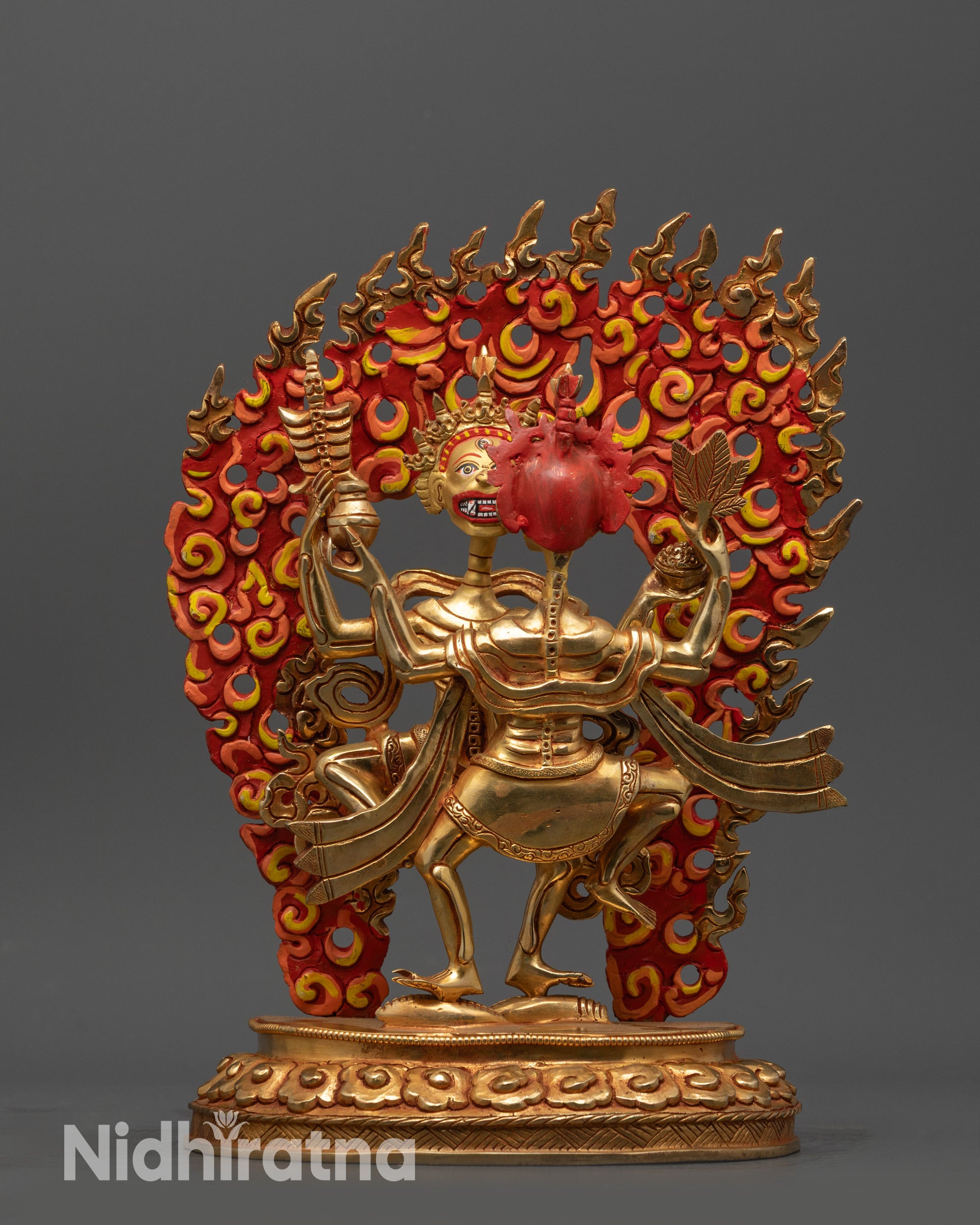 Front view Dancing Chitipati statue with gold-gilded face and gold fire-gilded body