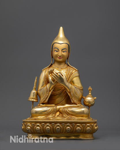 Front view Dipankara Atisha statue with gold-gilded face and lotus posture