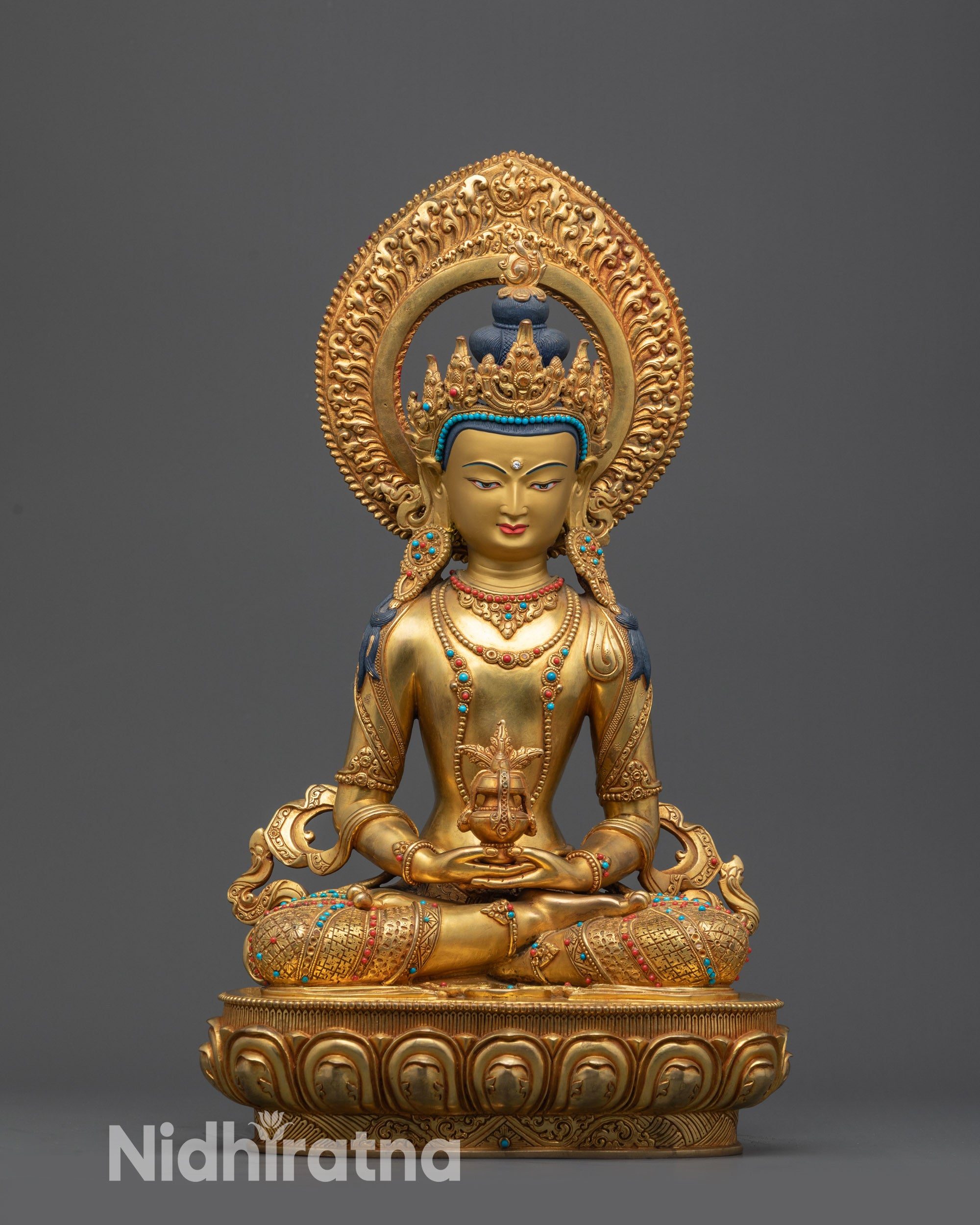 Front view Divine Amitayus Statue on lotus pedestal with gold-gilded face and crown