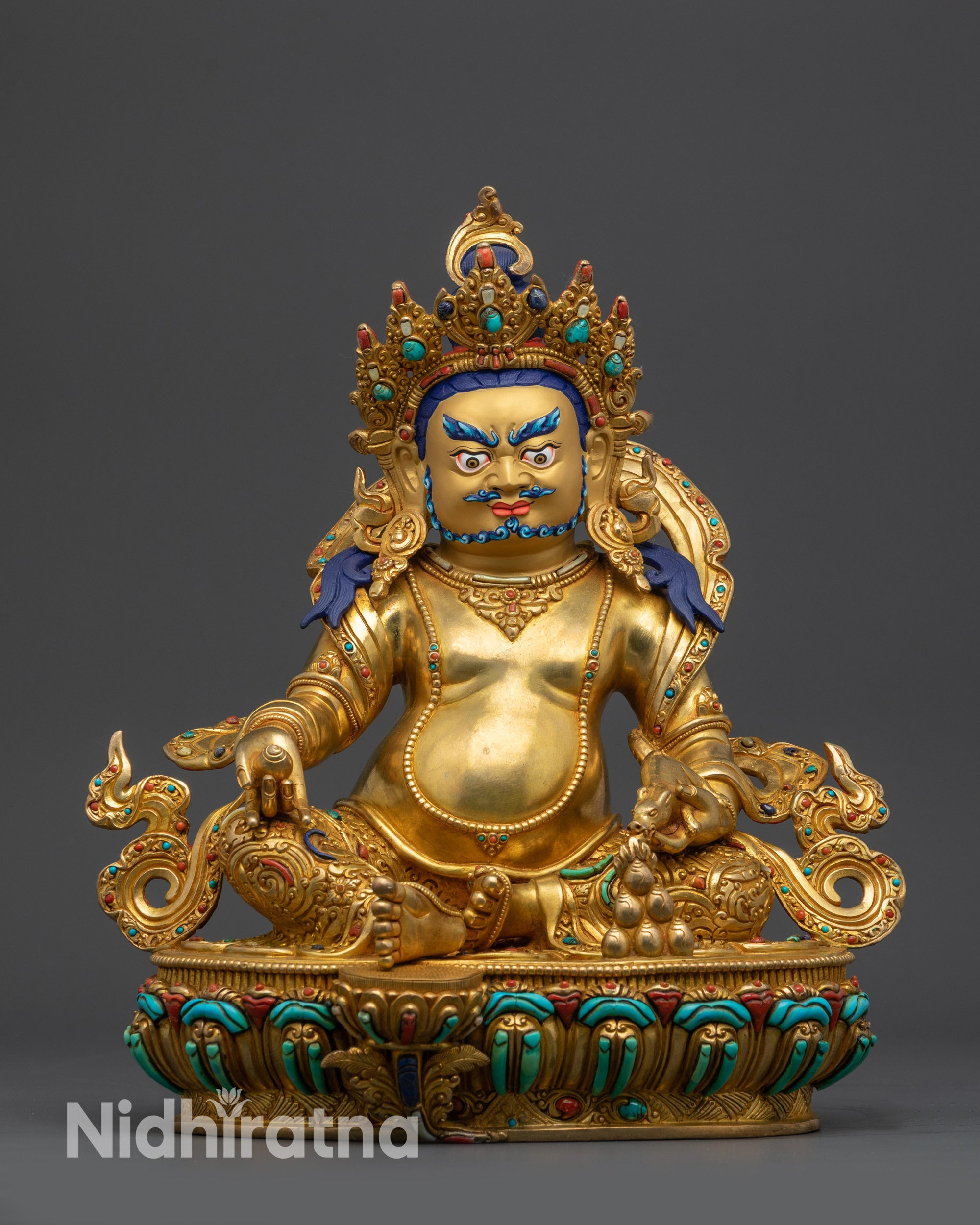Front view Dzambhala Statue showing gold-gilded Tibetan wealth deity seated on lotus base from Nepal
