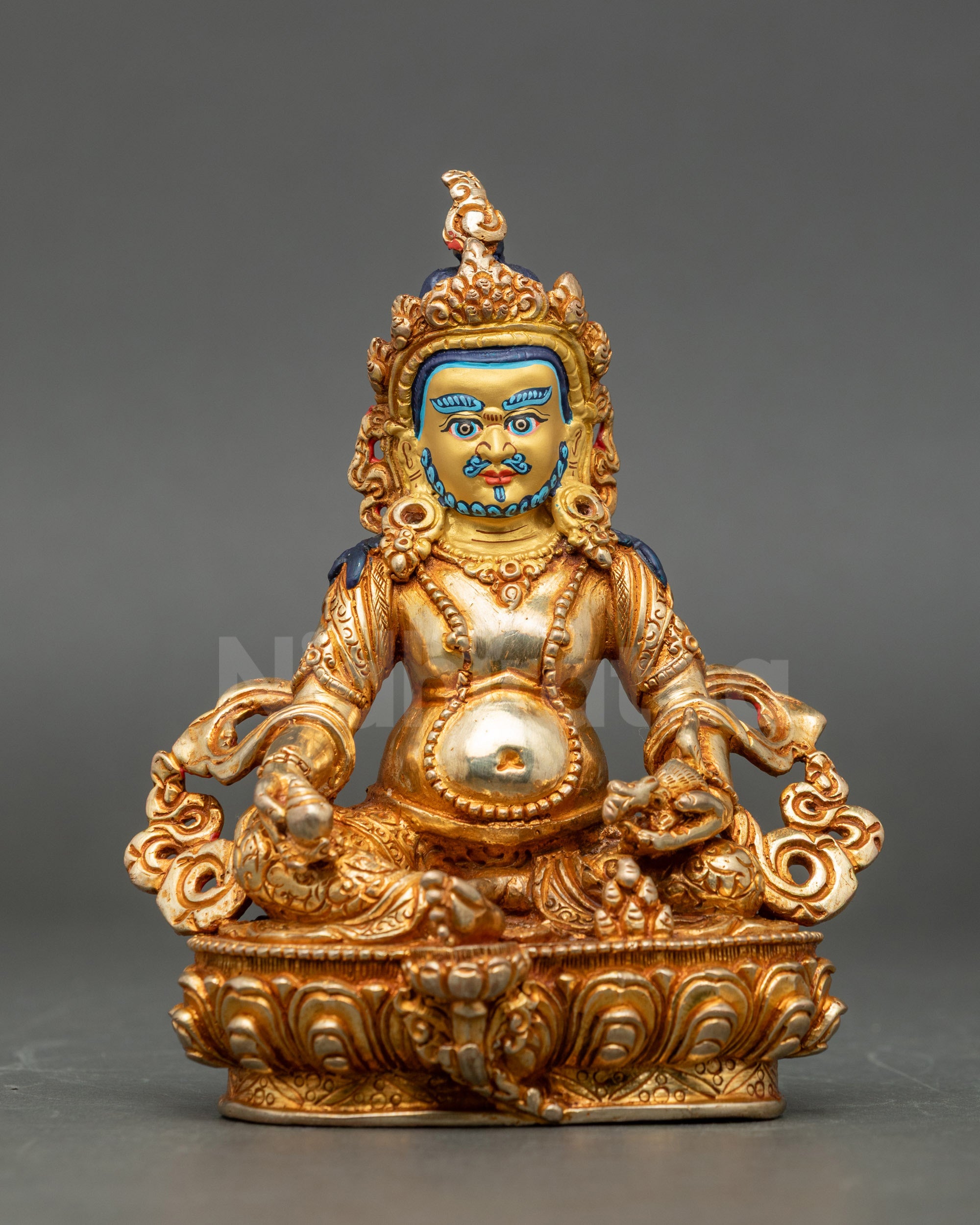 Front view Dzambhala statue gold-gilded copper handmade in Patan Nepal for wealth altar