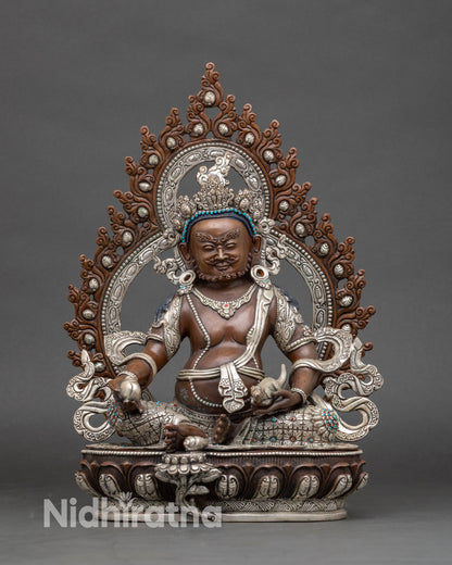 Front view Dzambhala statue in oxidized silver-plated copper with halo, lotus seat, citron and mongoose