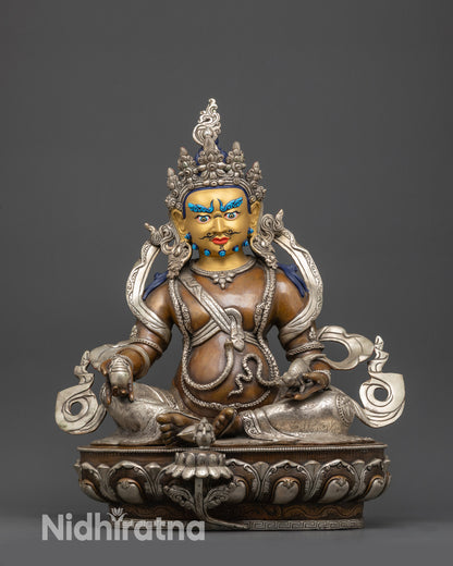 Front view Dzambhala statue with 24K gold-gilded face, lotus seat, citrons, and jewels
