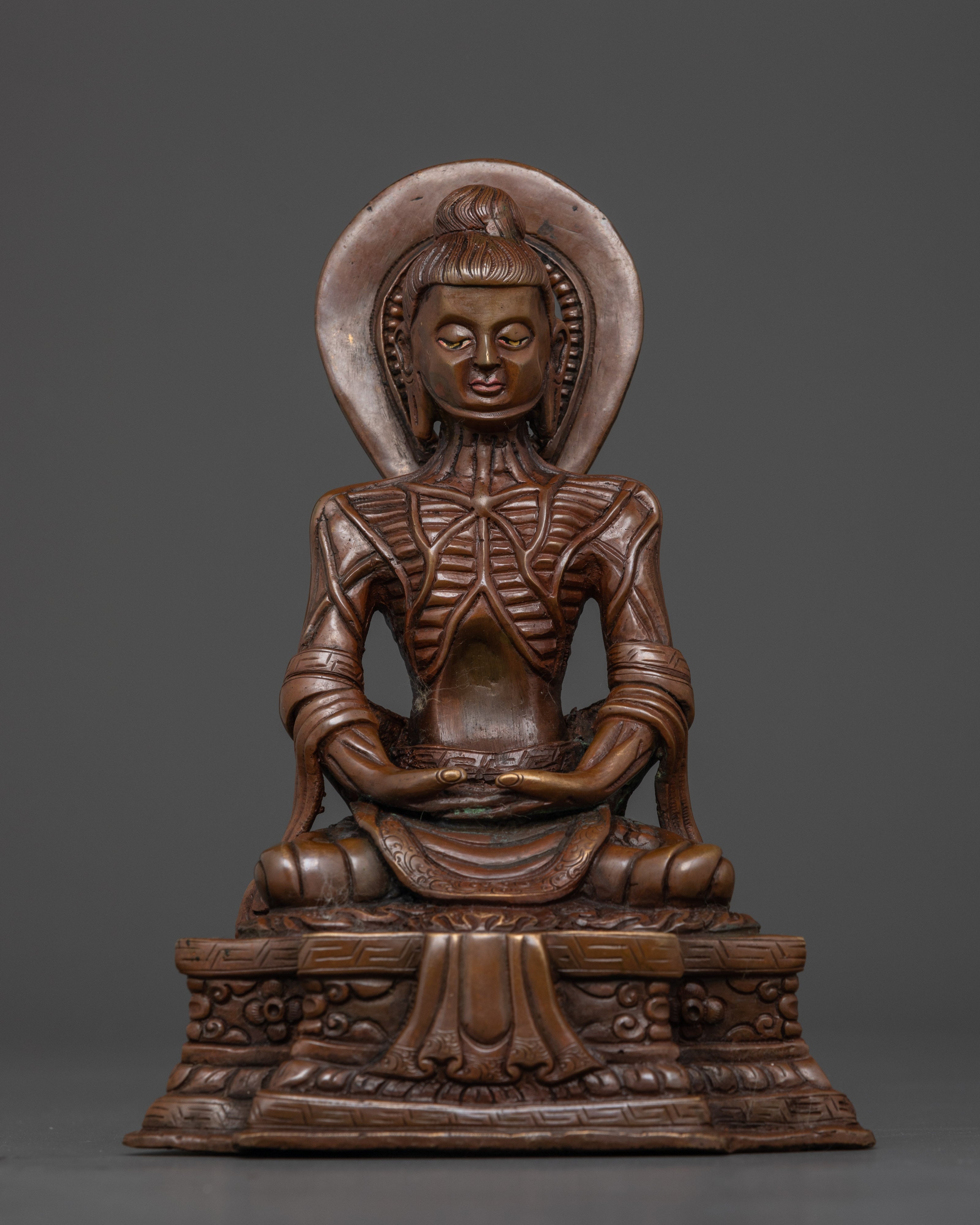 Front view Fasting Buddha statue oxidized copper Nepalese ascetic seated lotus throne