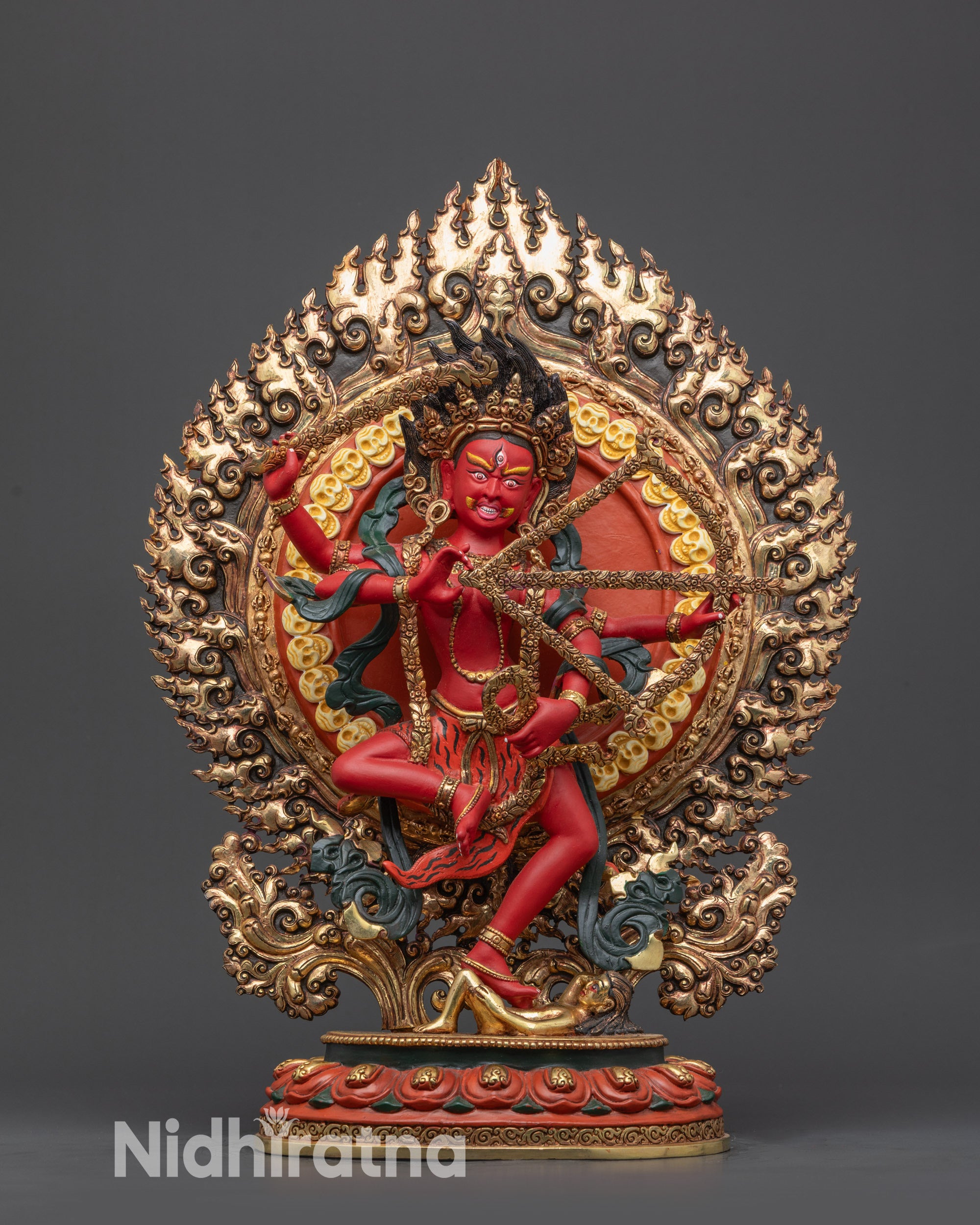 Front view Fierce Kurukulla Statue with red body and five-skull crown on lotus seat