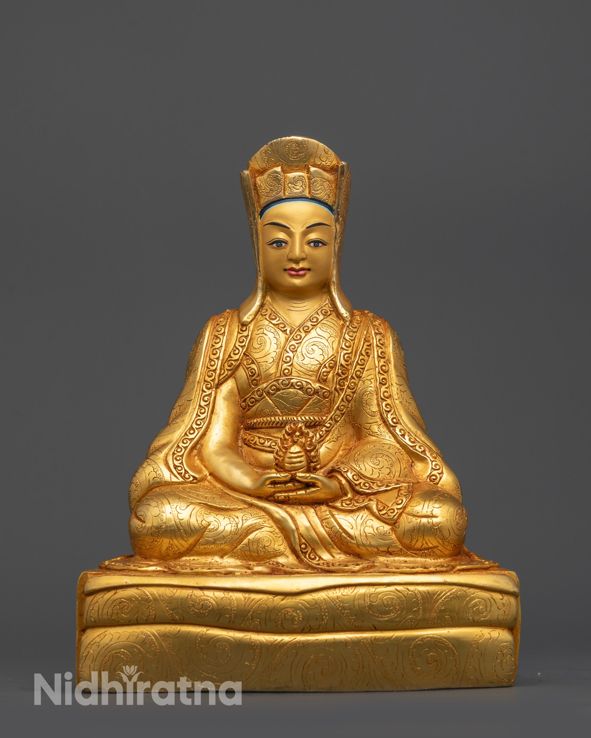Front view Gampopa Statue gold gilded face copper base Nepalese Buddhist artwork
