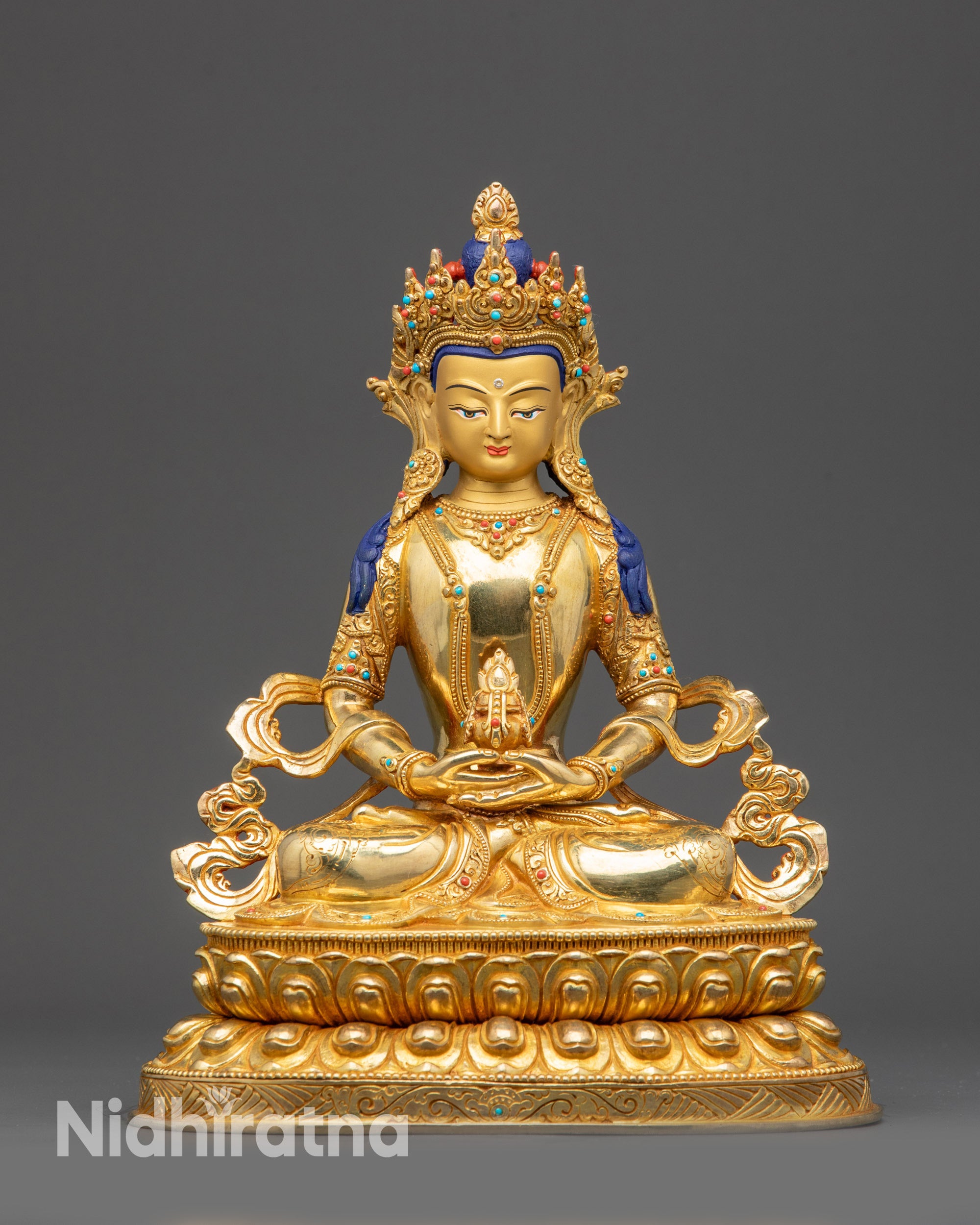 Front view Golden Amitayus Buddha statue on gold fire-gilded base with lotus pedestal
