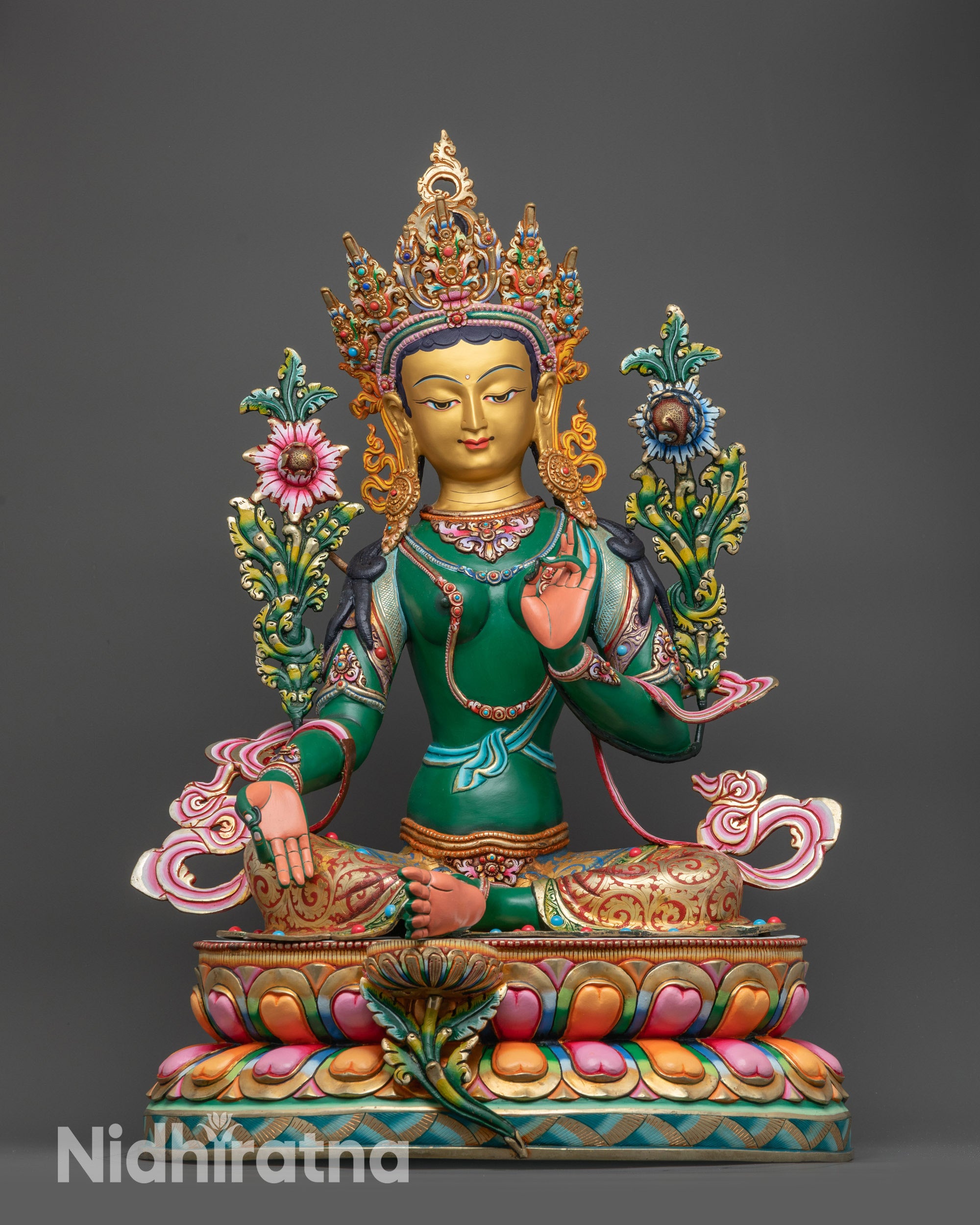 Front view Green Tara statue for meditation vibrant Nepalese goddess on lotus pedestal
