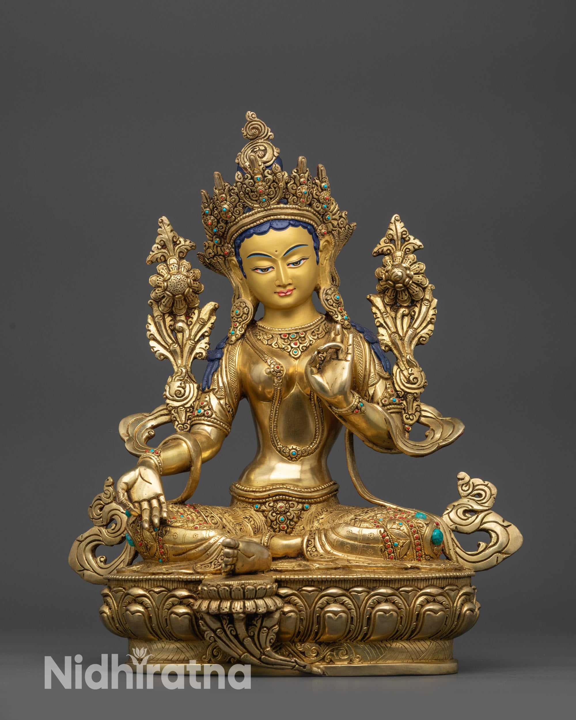 Front view Green Tara statue on lotus seat with gold-gilded face and crown