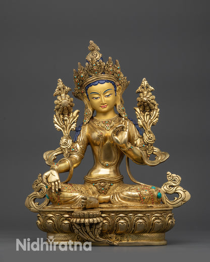 Front view Green Tara statue on lotus seat with gold-gilded face and crown