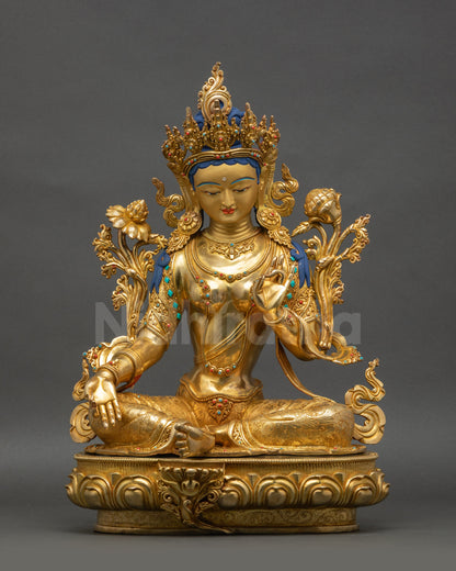 Front view Green Tara statue with gold-gilded face seated on lotus in royal ease