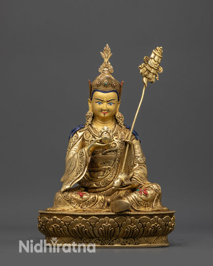 Front view Guru Norlha statue with gold-gilded face, lotus seat, and Nepal artisan details